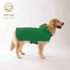 A golden retriever wearing a green all-weather dog raincoat.
