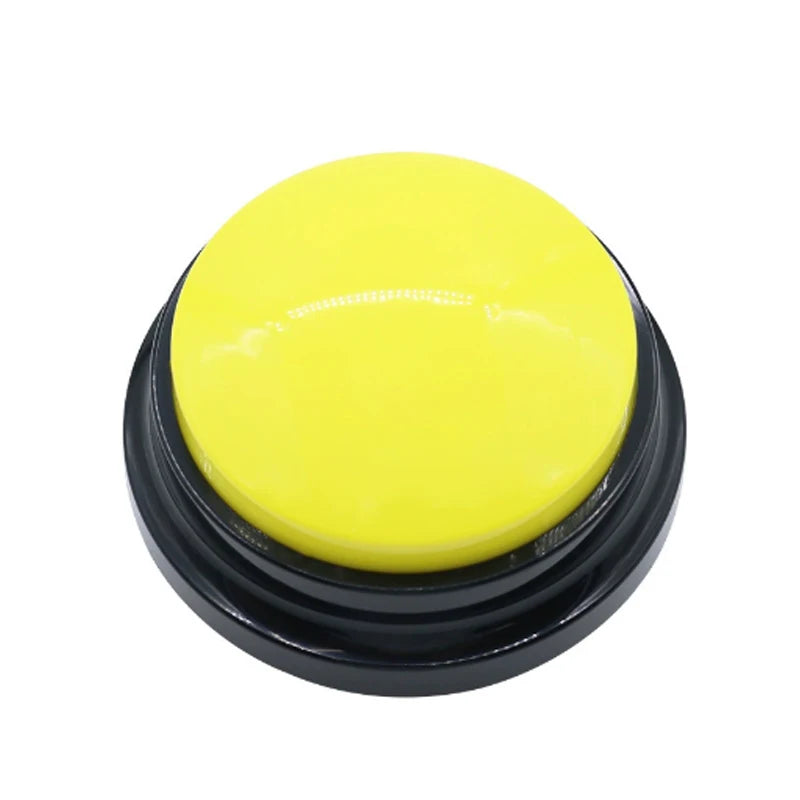 A round, bright yellow pet communication button with a black base for dog training.