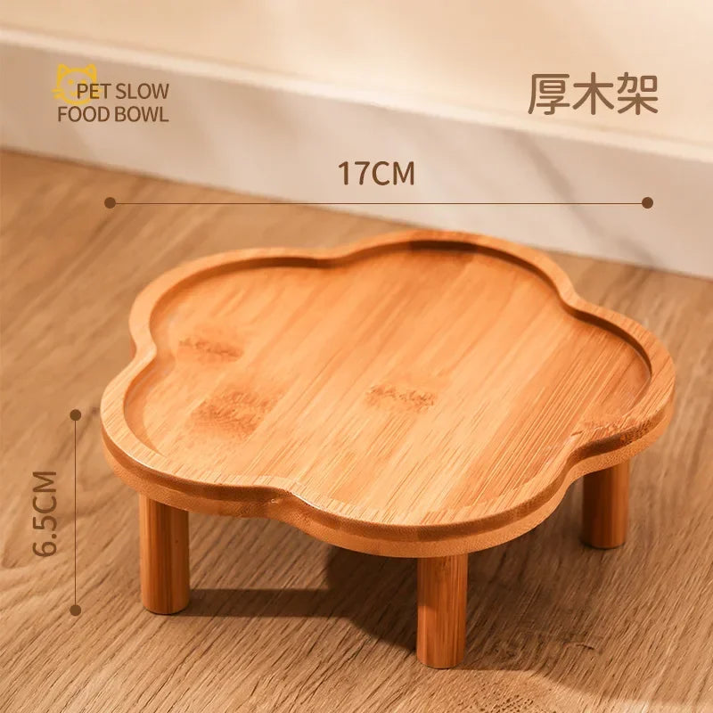 A wooden ceramic slow feeder cat bowl with a stand, showing its size and texture.