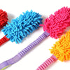 Assortment of colorful plush pull rope toys with blue, pink, and orange bristles.