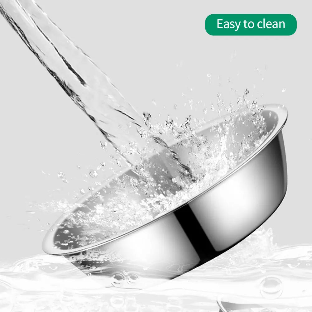 A stainless steel pet feeding bowl is being rinsed with water, demonstrating its easy to clean feature.