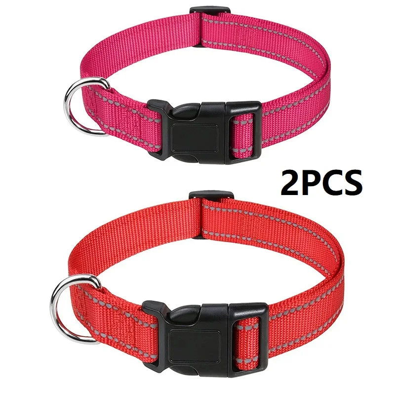 Two decorative nylon dog collars, one pink and one red, with buckles.