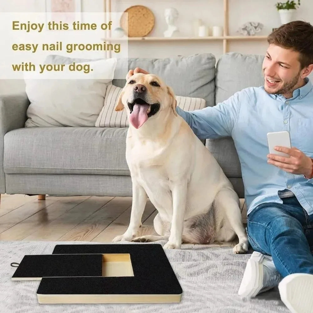 A man is shown enjoying nail grooming with his dog on a wooden scratching board and treat box.