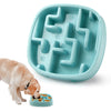 A teal anti-gulping slow feeder bowl for dogs and cats is shown with a dog eating kibble.
