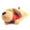 A light brown plush comfort toy shaped like a dog with a red heart detail.