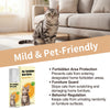 A bottle of Pet Forbidden Area Spray next to a domestic cat sitting on a sofa.