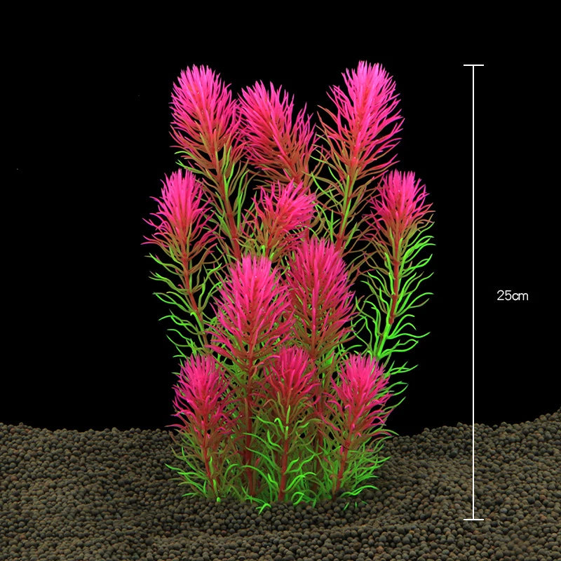 Un amas de plantes aquatiques artificielles roses et vertes poussant dans un substrat sombre.