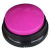 A round, bright pink pet communication recording button with a black base.