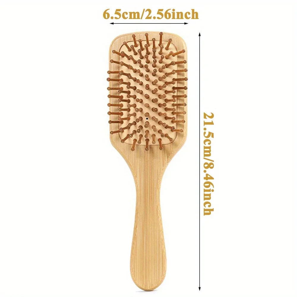 A wooden bamboo hair brush with massage bristles shown vertically, measuring 6.5cm wide and 21.5cm long.