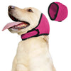 A light-colored dog is wearing a pink calming and comfort headgear collar.