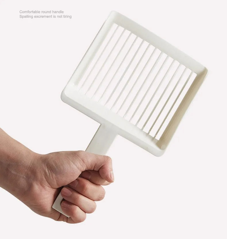 A hand is holding an extra-large white cat litter scoop with a hanging hook.