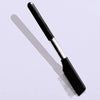 A black pet face comb with fine teeth is shown against a light background.