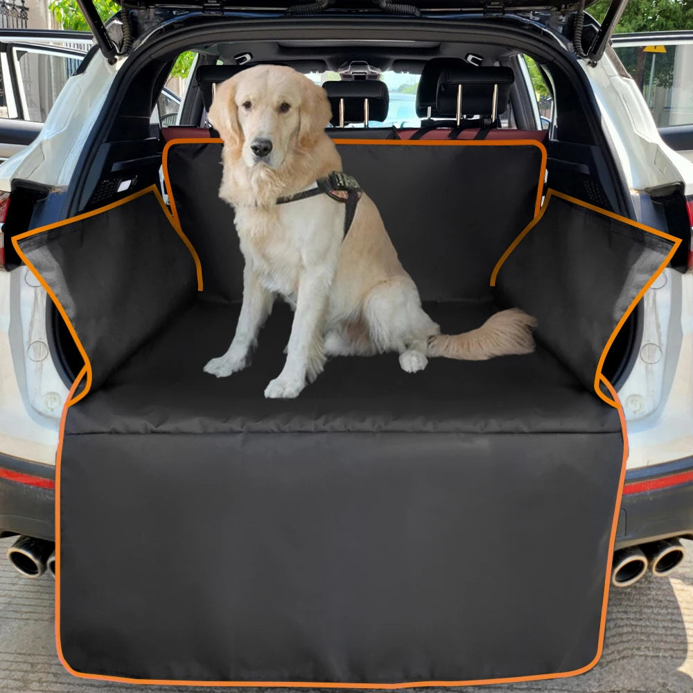A golden retriever sits on a black waterproof dog car seat cover inside a vehicle.