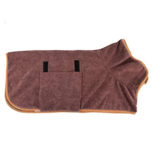 A dark brown ultra soft pet drying towel with black handles and an orange trim.