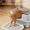 An orange tabby cat standing on a white dual-layer cat litter mat with an anti-slip base.