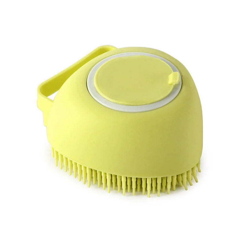 A yellow silicone pet bath massage brush with a foam maker attachment.