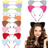 A display of various plush cat ear headbands in different colors and styles.