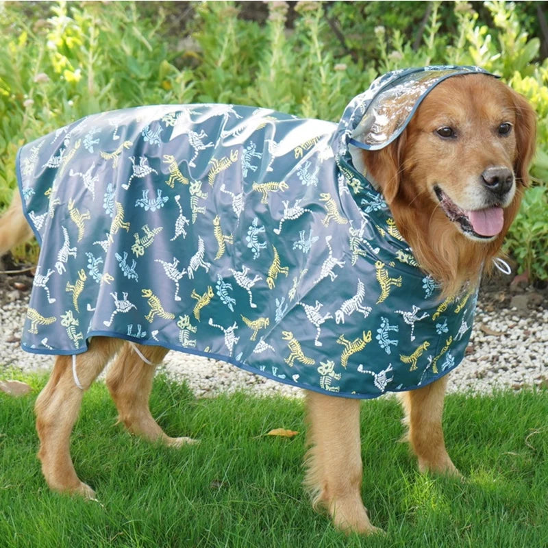 A golden-colored dog wearing a blue waterproof raincoat with a hood outdoors.
