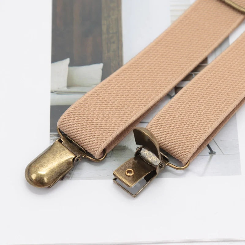Tan woven suspenders with brass clip-on buckles shown against a white background.