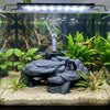 A realistic 3D printed fish tank rockery ornament featuring rocks and aquatic plants.