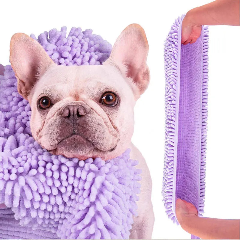 A light pink French Bulldog is being bathed with a purple ultra-absorbent chenille pet bath towel.