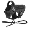 A black durable dog harness and leash set for training and walking.