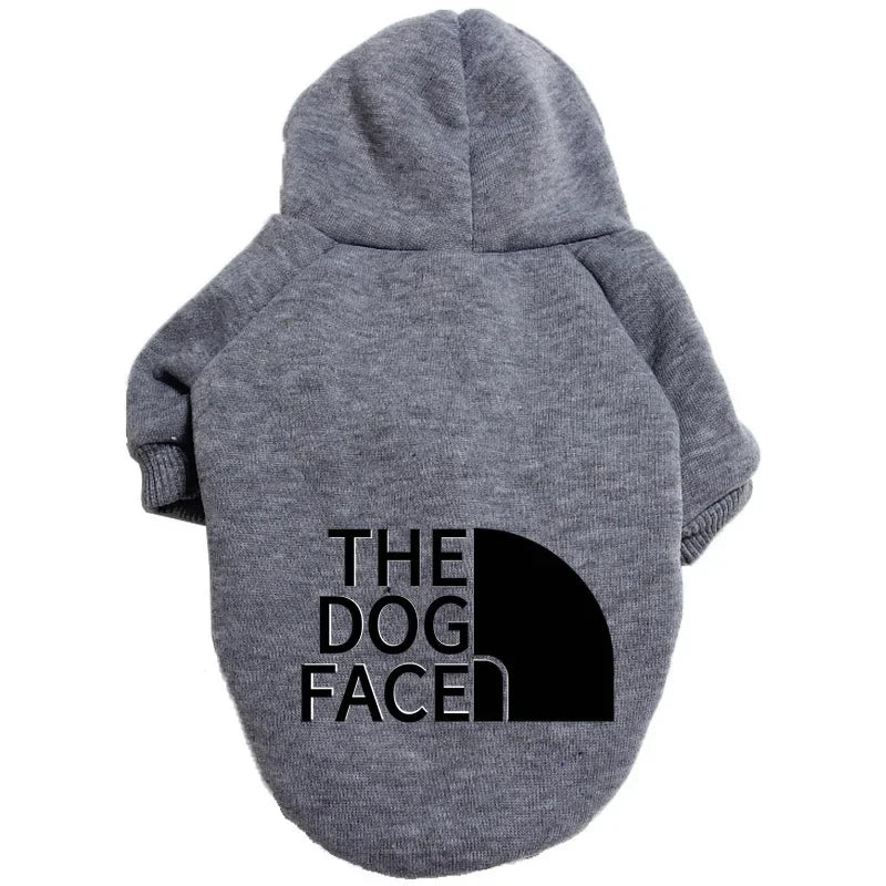 A gray cozy fleece dog hoodie with a hood and the text THE DOG FACED printed on the back.