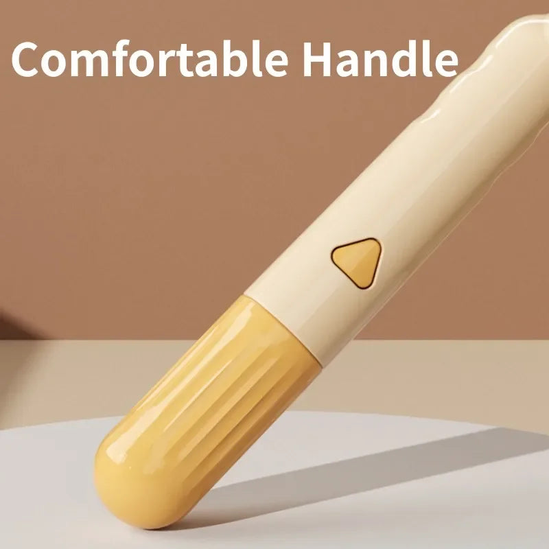A close-up view of a beige pet brush with a comfortable handle and massage pins.