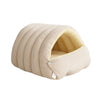 A beige plush cat cave bed with ribbed fabric and a removable yellow lining.