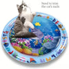 A playful kitten is shown on a blue mat featuring an ocean fish design for cat nail trimming.