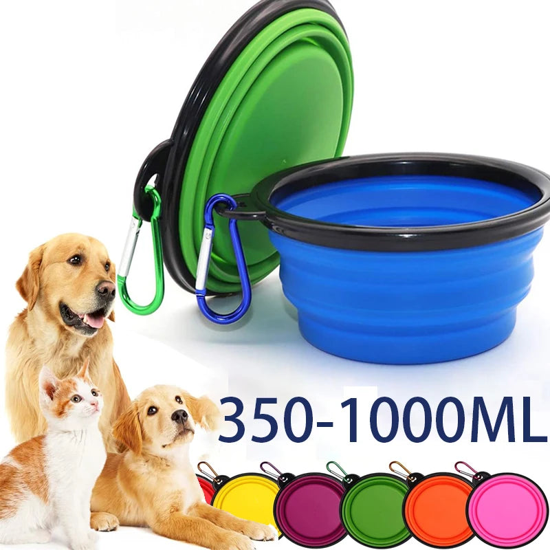 A green and blue silicone pet feeder bowl with carabiner clips and various colored silicone feeders.
