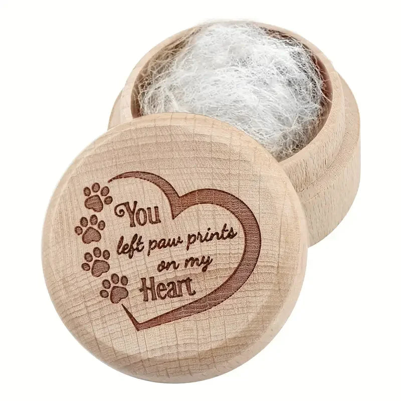 A natural wooden keepsake box containing soft white pet hair.
