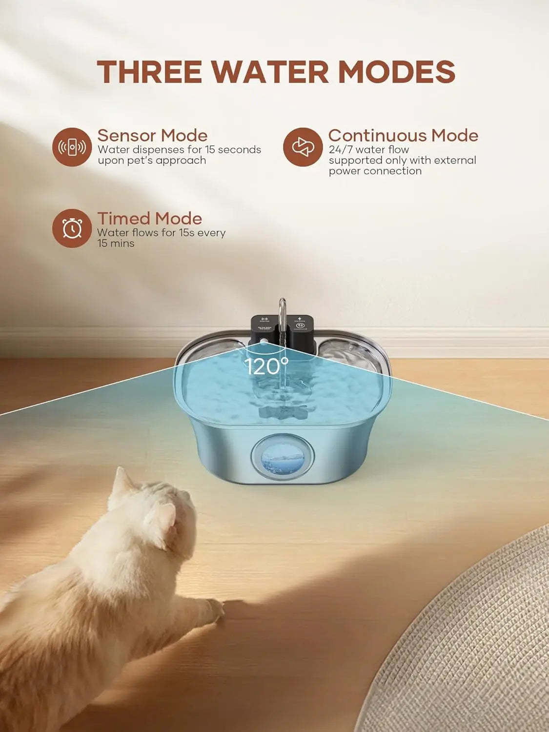 A stainless steel cat water fountain is placed on a wooden floor with a white cat looking at it.