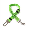 A bright lime green reflective dog seat belt with an adjustable nylon harness and metal clip.