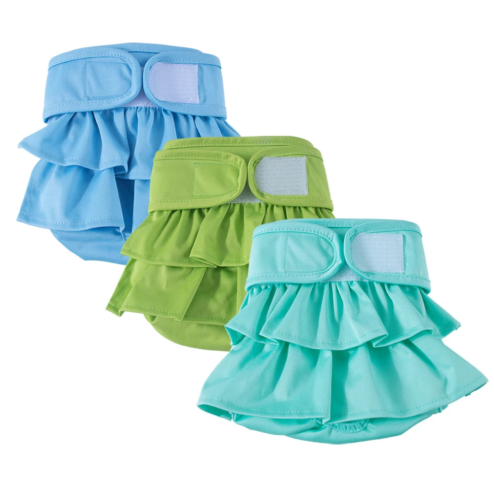 A set of reusable washable dog diapers in light blue and lime green colors.
