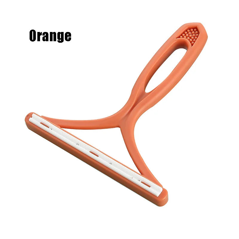 Orange silicone pet hair and lint remover tool with a flexible handle and cleaning bristles