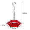 A hanging hummingbird feeder with a clear tube and a red, hexagonal feeding platform.