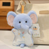 A light blue elephant bean bag plush toy with pink ears is displayed against a cream-colored bag.