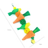 Handwoven natural vine bird and pet swing toy featuring green and orange fibers.