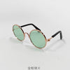Vintage round pet sunglasses with light green lenses and gold-toned metal frames
