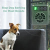 A green ultrasonic anti-barking device is shown hanging on a window, with a dog sitting in front of a dark sofa.