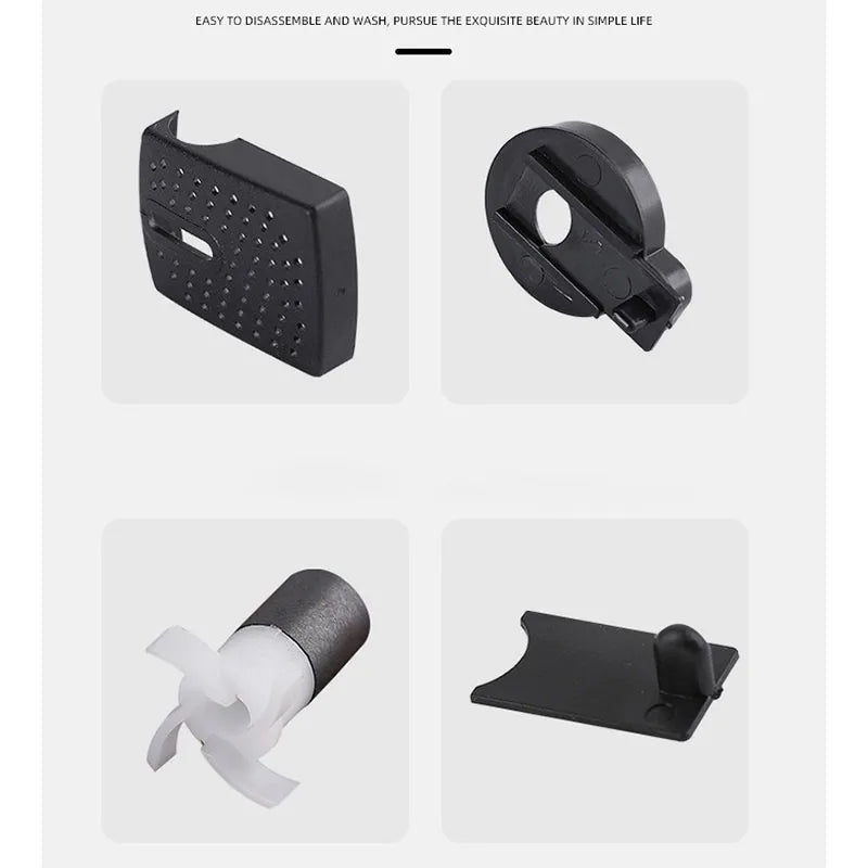 Un jeu de pièces pour pompe submersible comprenant un corps de pompe noir, un cap noir et une buse en silicone blanche.