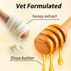 Honey extract and shea butter are shown in wooden honey dippers for pet grooming.