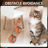 A tabby cat is interacting with an orange and gray silicone obstacle avoidance toy designed for interactive play.