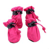 Pair of bright pink cozy anti-slip dog booties with black reflective grips