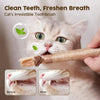 A cat is using a natural silver vine toothbrush to clean its teeth, showing before and after results.