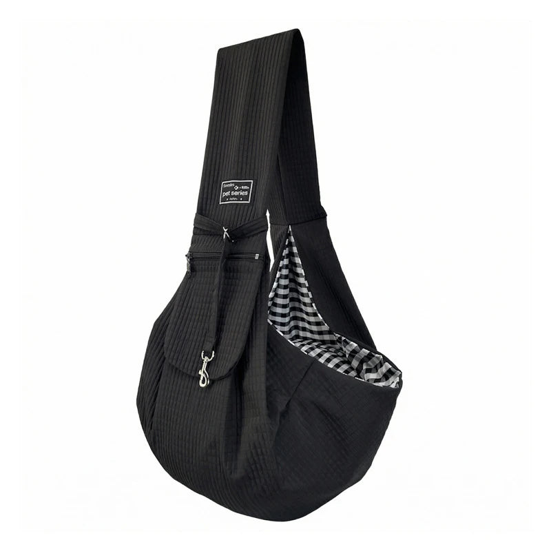 Black fabric crossbody pet carrier bag with a checkered pattern detail