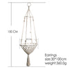 Macrame cat hammock bed for pet decor featuring a hanging woven design with a tassel.