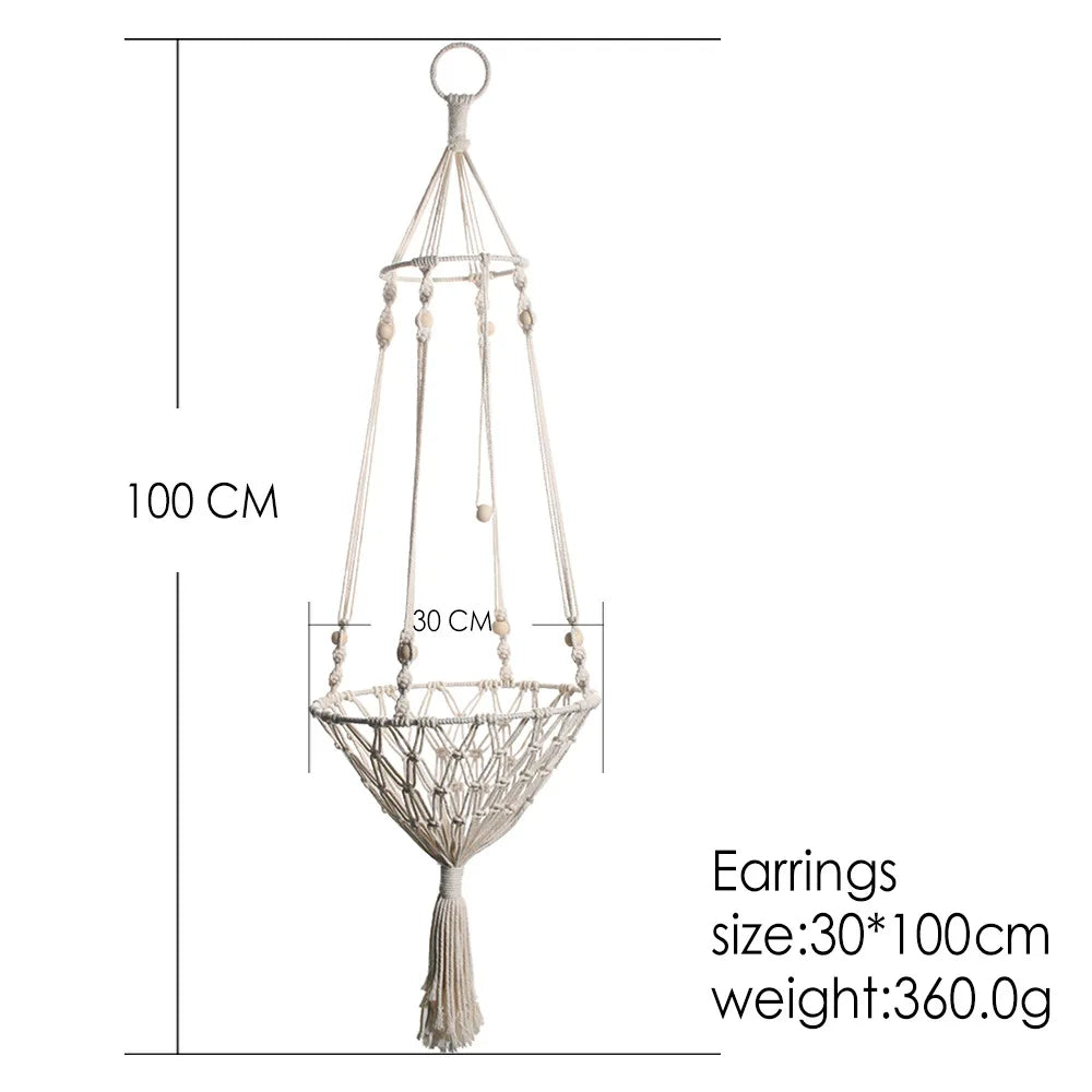Macrame cat hammock bed for pet decor featuring a hanging woven design with a tassel.