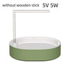 A white automatic bird bathtub with a resting stick, featuring a light green base.